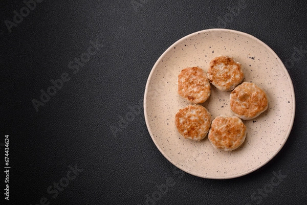 Fototapeta Fried meatballs of minced meat beef, pork or chicken with salt, spices and herbs