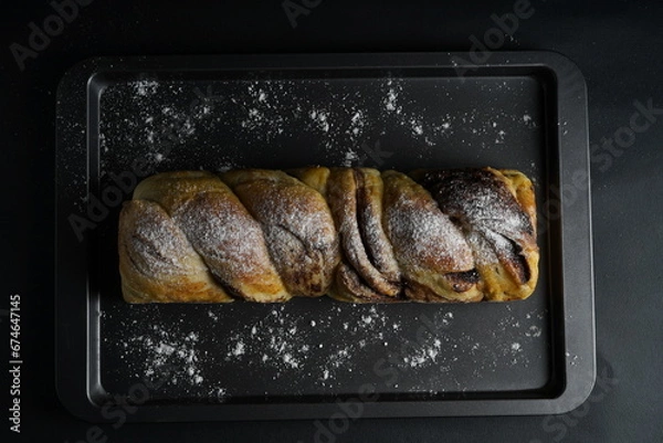 Obraz Chocolate Bread and butter cake with black background