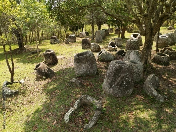 Fototapeta Historic Plain of Jars on a grassy green field in Laos