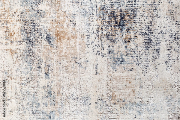 Fototapeta The texture of the carpet with an abstract pattern, close-up.