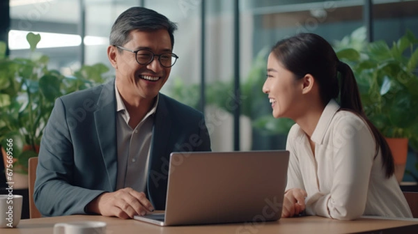 Fototapeta Male and female businessmen Working together happily, laughing and smiling. Analyze business data from worldwide network data connection.