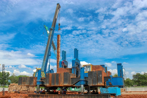 Fototapeta Hydraulic Jack in Pile. (also known as 'press-in piling') is an innovative technique for the installation of pre-formed piles, in which hydraulic rams are used to push the piles into the ground. 
