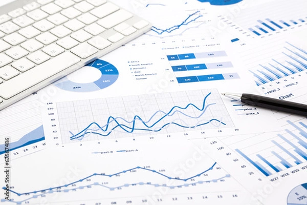 Obraz blue graph and chart reports on office table