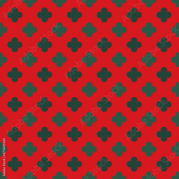 Fototapeta Green floral pattern on a red background for Christmas.