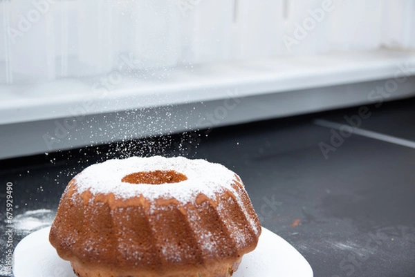 Obraz sprinkling cake with powdered sugar