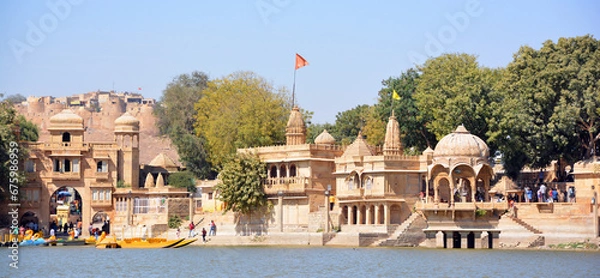 Fototapeta Gadisar lake in the morning. Man-made water reservoir with temples in Jaisalmer. Rajasthan. India