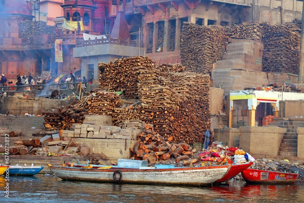 Obraz View of the ceremony of the cremation of a unknown Hindu person at Manikarnika Ghat front the Ganges river in Varanasi India