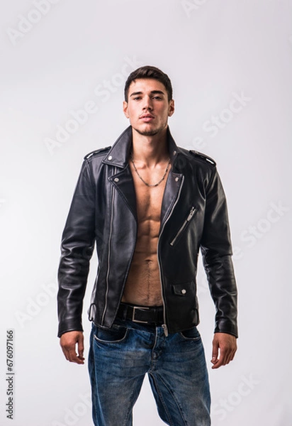 Fototapeta A man in a leather jacket posing for a picture