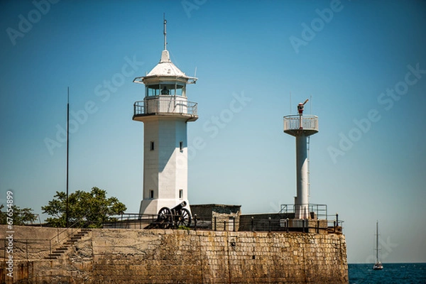 Obraz white lighthouse on seafront of Yalta
