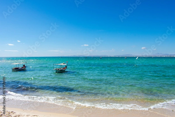 Fototapeta Hammamet Tunisia, Beach and  boats on shallow water, view on Mediterranean sea 