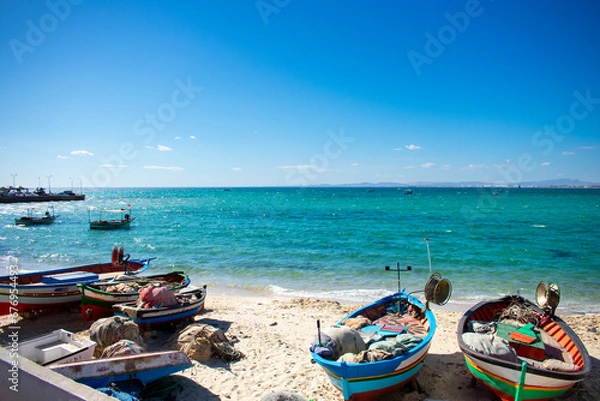 Fototapeta Hammamet Tunisia, Beach and  boats on shallow water, view on Mediterranean sea 
