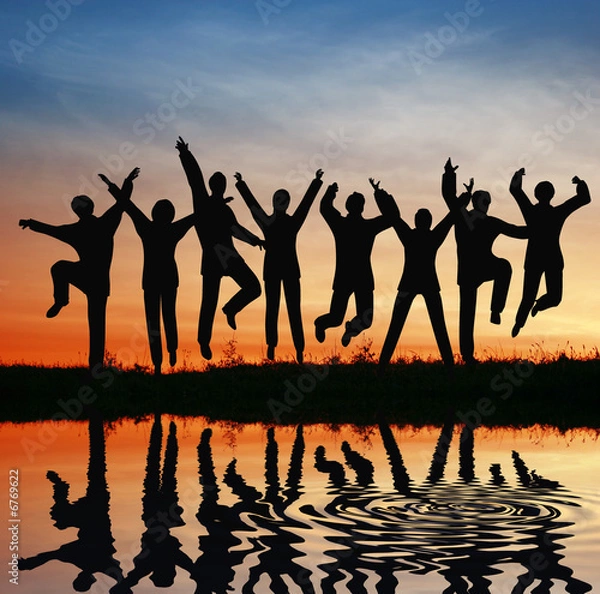 Fototapeta silhouette jump team. sunset pond