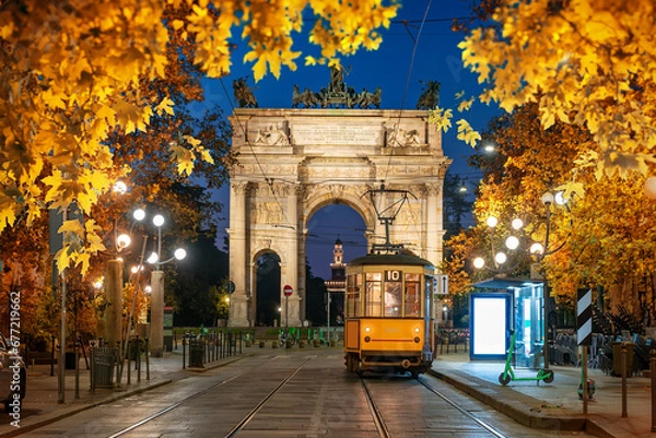 Fototapeta Arch and yellow tram in autumn