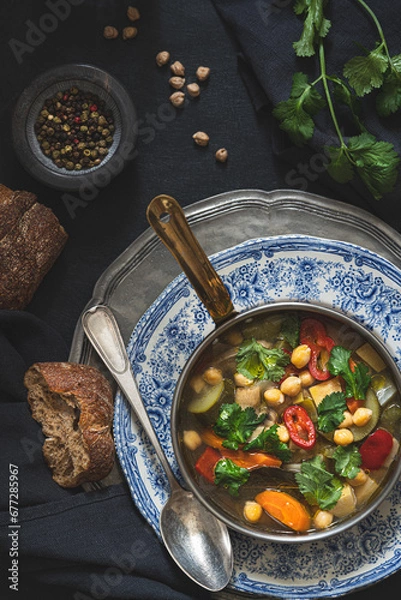 Fototapeta Vegetable  appetizing soup. Antique tableware. Rustic table set.
