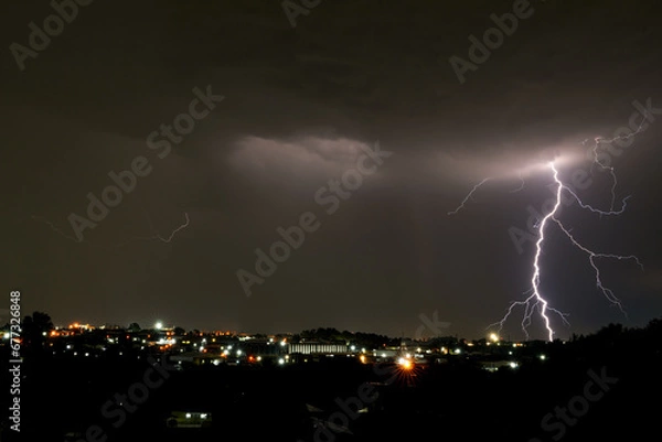 Fototapeta Beautiful Lightning bolt strike Over Kempton Park, Stunning and dangerous power energy that exists in nature as a storm passes over with heavy rain fall and storms