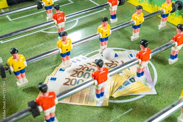 Obraz Sports and money. Table football game, Concept about money spending in football soccer, sports betting and manipulated fixed matches.