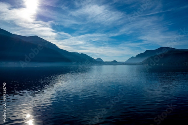 Fototapeta Lake Lugano with Sunlight and Mountain in Morcote, Ticino in Switzerland.