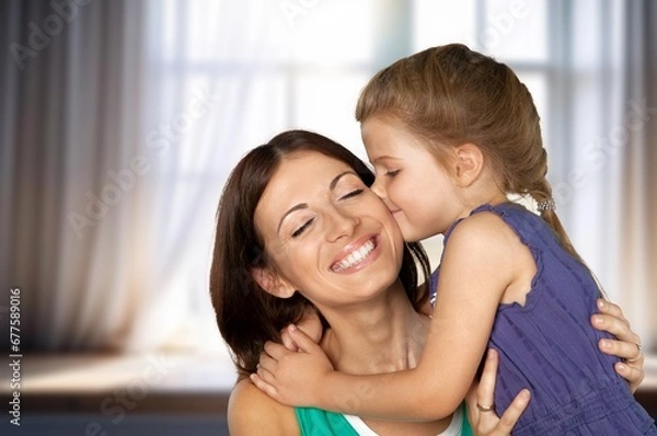 Fototapeta portrait happy parent and adorable child hugging