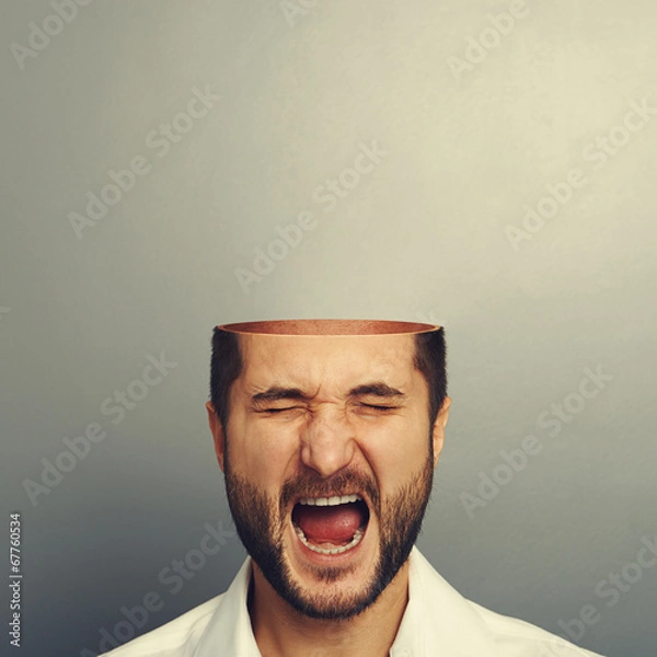 Fototapeta screaming man with open head over grey