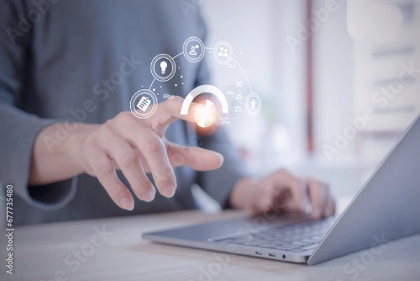 Fototapeta person planning the business plans and analyse  profitability of working companies with digital augmented reality graphics for project manager working on laptop and updating business plan