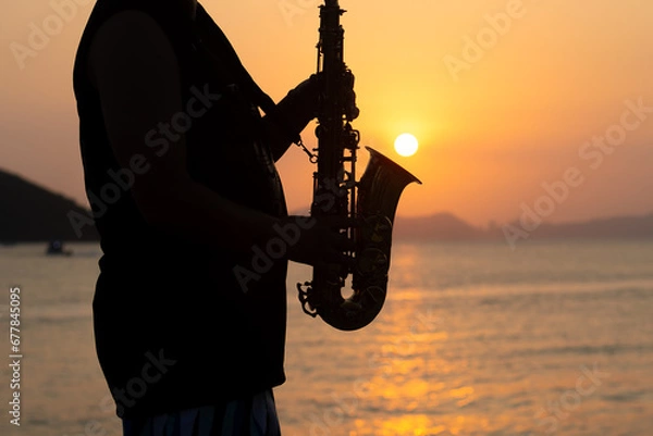 Obraz Musician playing saxophone during sunset