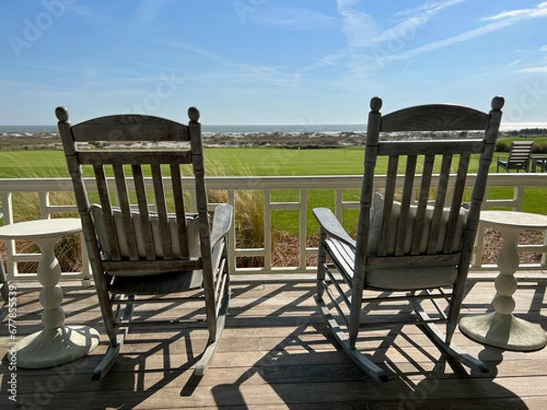 Obraz Rocking chairs overlooking the Ocean Course Golf Course on Kiawah Island in South Carolina.