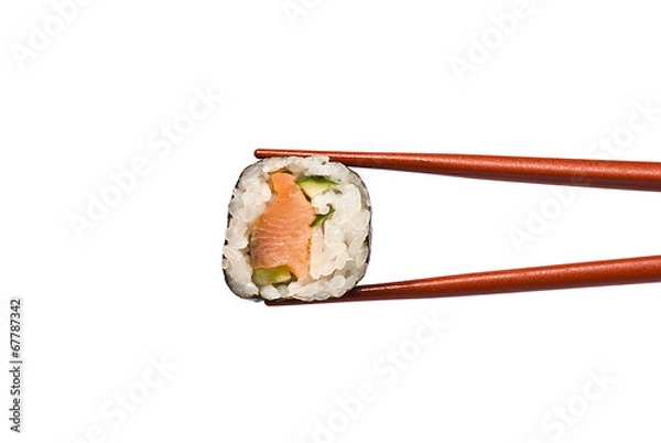 Fototapeta Sushi Roll is held by Chopsticks isolated on white