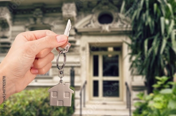 Obraz Human hand hold key for unlocking new house