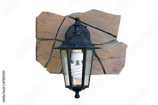 Fototapeta Street light on a fragment of a stone wall.