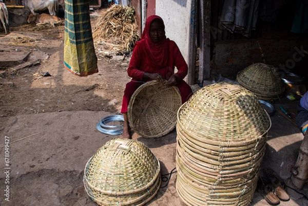 Fototapeta Rice basket-making process manually by using the traditional way