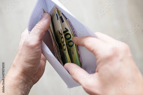 Obraz hand holding euro banknotes