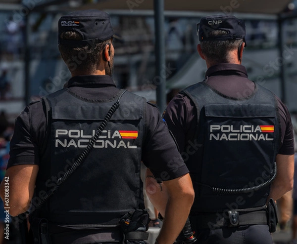 Obraz Policemen in the harbor of Cadiz, Spain