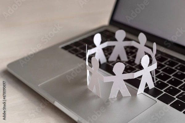 Fototapeta online community concept, virtual group of people, paper humans stand together in circle on computer keyboard
