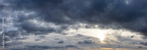 Fototapeta panoramic cloudscape with dark moody atmospheric clouds