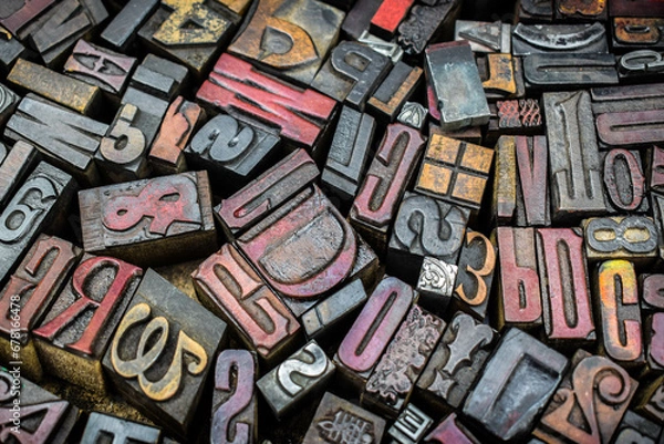 Obraz A textured background of old, used, wooden type-setting letter blocks with various fonts, upper- and lowercase, antique letters, all shapes and sizes. 