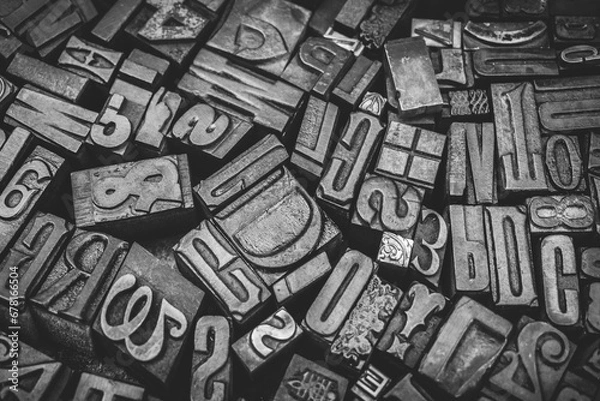 Obraz A textured background of old, used, wooden type-setting letter blocks with various fonts, upper- and lowercase, antique letters, all shapes and sizes. 