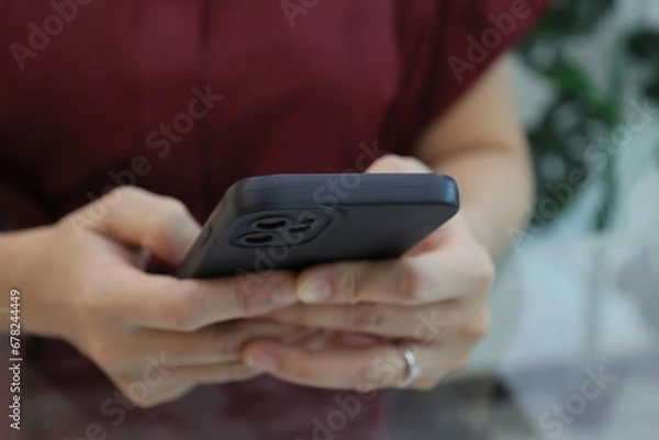 Fototapeta person holding phone 