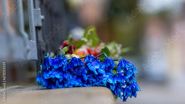 Fototapeta A colourful bouquet left outside after a celebration.