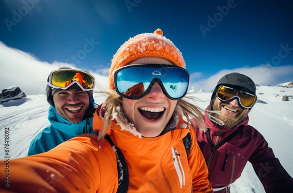 Fototapeta Sport and travel backgrounds. Winter, ski, snow and fun. Family enjoying ski holiday and taking selfie.