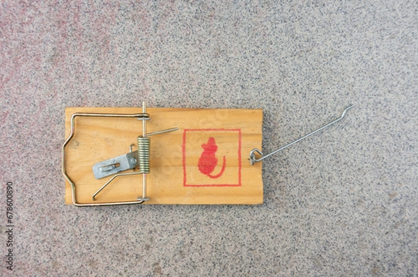Fototapeta Mousetrap with painted red mouse. Empty. Open.