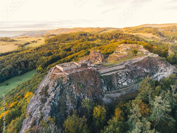 Fototapeta Kalich (Kelchberg in German) is a castle ruin above the village of Trebusin. The castle was founded by the Hussite governor Jan Zizka in 1421.