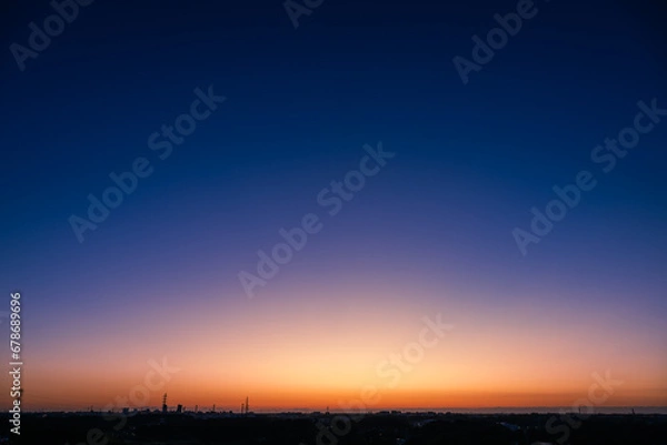 Obraz 雲一つない澄み切った暁の空