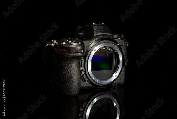 Fototapeta Digital sensor mirrorless camera body with reflection on dark background