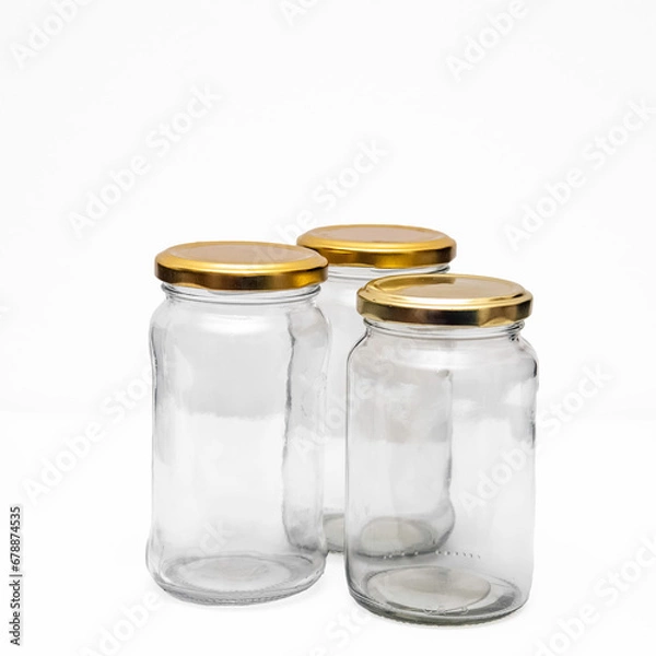 Fototapeta Three empty jars on somewhat gray white background