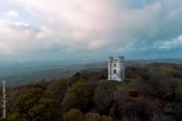 Fototapeta Haldon Belvedere (Lawrence Castle) in Haldon forest, Devon during golden hour with a stormy sky. 