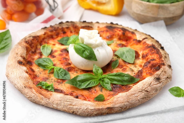 Fototapeta Delicious pizza with burrata cheese and basil on table, closeup