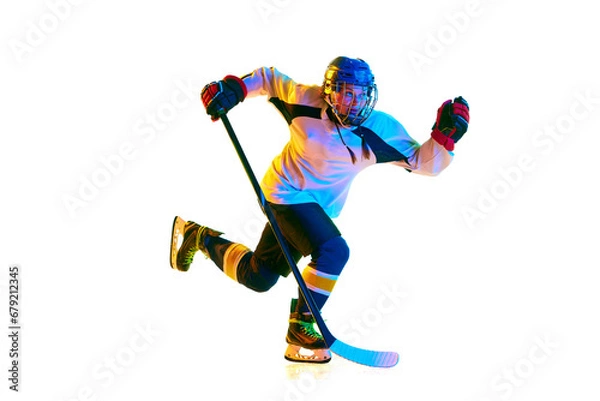 Fototapeta Champion. Young girl, hockey player in motion, wearing uniform, playing with stick against white background in neon light. Concept of professional sport, competition, game, action, hobby