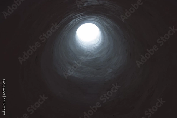 Obraz Ciemny tunel prowadzący do światła otworu.