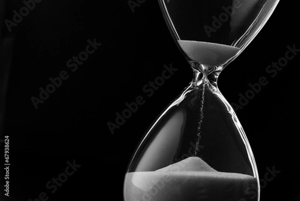 Obraz Piasek przeciskający się przez żarówki klepsydry