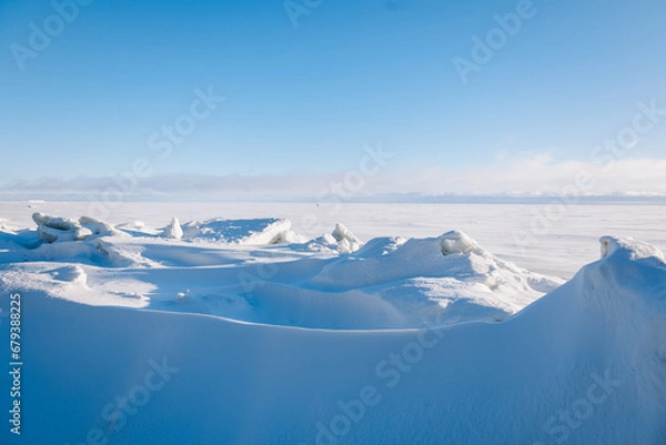Obraz Beautiful winter landscape. Field of white snow and ice on horizon. Light and airy feel and light color palette. High quality photo